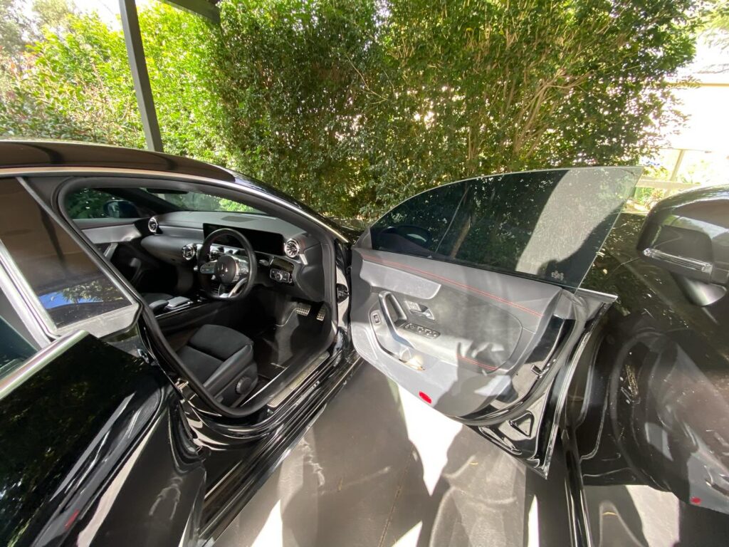 Rear car window shattered for no reason in Whale Beach